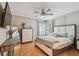 Cozy bedroom featuring a ceiling fan, natural light and neutral walls at 2667 Aspen Ct, Palm Harbor, FL 34684