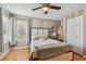 Comfortable bedroom with stylish decor, including a surfboard and neutral walls at 2667 Aspen Ct, Palm Harbor, FL 34684