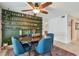 Dining area featuring ceiling fan, rustic shelves and cozy seating at 2667 Aspen Ct, Palm Harbor, FL 34684