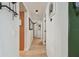 Hallway with tile flooring and neutral wall paint at 2667 Aspen Ct, Palm Harbor, FL 34684