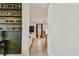 Hallway leading to the living area features tile flooring and convenient shelving at 2667 Aspen Ct, Palm Harbor, FL 34684