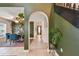 Hallway with tile flooring and architectural details leading to dining area at 2667 Aspen Ct, Palm Harbor, FL 34684