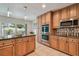 Gourmet kitchen featuring stainless steel appliances and granite countertops at 2667 Aspen Ct, Palm Harbor, FL 34684
