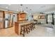 Kitchen featuring a breakfast bar, stainless steel appliances, and open layout at 2667 Aspen Ct, Palm Harbor, FL 34684