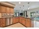 Well-equipped kitchen featuring stainless steel appliances, breakfast bar, and a pool view at 2667 Aspen Ct, Palm Harbor, FL 34684