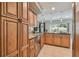 Kitchen boasting ample storage with granite countertops and stainless steel appliances at 2667 Aspen Ct, Palm Harbor, FL 34684