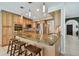 Kitchen island with barstool seating, granite counters, and stainless steel appliances at 2667 Aspen Ct, Palm Harbor, FL 34684