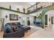 Spacious living room with high ceilings, tile floors, and plenty of natural light, perfect for entertaining at 2667 Aspen Ct, Palm Harbor, FL 34684