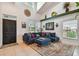 Inviting living room featuring vaulted ceilings, natural light, and comfortable seating at 2667 Aspen Ct, Palm Harbor, FL 34684
