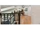 Open loft area overlooking the living room, ideal for a home office with hardwood floors and natural light at 2667 Aspen Ct, Palm Harbor, FL 34684