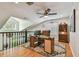 Bright loft space with hardwood floors offers a versatile area perfect for a home office or study, with natural light at 2667 Aspen Ct, Palm Harbor, FL 34684