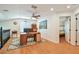 Loft area featuring hardwood floors and natural light, perfect for a home office or study, conveniently located near bedrooms at 2667 Aspen Ct, Palm Harbor, FL 34684