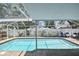 Beautiful screened-in pool area with inviting blue lounge chairs at 2667 Aspen Ct, Palm Harbor, FL 34684