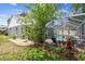 View of backyard, patio, pool and landscaping at 2667 Aspen Ct, Palm Harbor, FL 34684