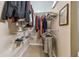 Well-organized walk-in closet offering ample storage space for clothing and accessories at 2667 Aspen Ct, Palm Harbor, FL 34684