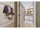 Walk-in closet leading into an ensuite bathroom with updated fixtures at 2667 Aspen Ct, Palm Harbor, FL 34684