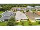 An aerial photo showcases the backyard, patio, and landscaping of a home in a residential area at 2973 Breezy Meadows, Clearwater, FL 33760