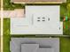 Overhead view of the house highlighting the roof, driveway, and green surrounding property at 2973 Breezy Meadows, Clearwater, FL 33760