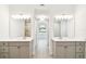 Dual bathroom vanities with white countertops, gray cabinetry, and modern fixtures at 2973 Breezy Meadows, Clearwater, FL 33760