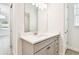 Bathroom vanity with white countertop, gray cabinetry, and modern fixtures at 2973 Breezy Meadows, Clearwater, FL 33760