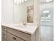Bathroom vanity with white countertop, gray cabinetry, and modern fixtures at 2973 Breezy Meadows, Clearwater, FL 33760