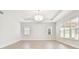 Large bedroom with tray ceiling, recessed lighting, and windows providing plenty of natural light at 2973 Breezy Meadows, Clearwater, FL 33760