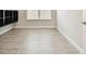 Cozy bedroom featuring modern flooring and a built-in shelving unit at 2973 Breezy Meadows, Clearwater, FL 33760