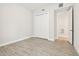 Simple bedroom featuring a closet and bright window at 2973 Breezy Meadows, Clearwater, FL 33760
