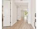 Bright foyer featuring wood-look flooring with view of the living space at 2973 Breezy Meadows, Clearwater, FL 33760