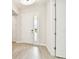 Inviting foyer with light wood-look tile floors, showcasing the bright and airy entrance at 2973 Breezy Meadows, Clearwater, FL 33760