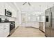 Spacious kitchen with stainless appliances, stylish lighting, and an open layout at 2973 Breezy Meadows, Clearwater, FL 33760
