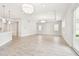 Spacious living area with kitchen view, recessed lighting and a sliding glass door at 2973 Breezy Meadows, Clearwater, FL 33760