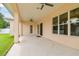 Spacious covered patio with ceiling fans and sliding glass doors at 2973 Breezy Meadows, Clearwater, FL 33760