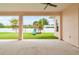 Spacious covered patio overlooking a backyard with a play set at 2973 Breezy Meadows, Clearwater, FL 33760