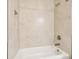 Tiled shower-tub combination with a built-in niche, providing a spa-like experience at 2973 Breezy Meadows, Clearwater, FL 33760