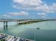 Picturesque waterfront view featuring a bridge, boat marina, and scenic waterway at 2973 Breezy Meadows, Clearwater, FL 33760