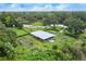 Aerial view of farm and land with multiple garden plots at 307 Los Prados Dr # 307, Safety Harbor, FL 34695