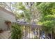 Balcony view of trees, shrubs, plants and a few parked cars at 307 Los Prados Dr # 307, Safety Harbor, FL 34695