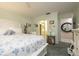 Cozy bedroom with blue floral bedding, carpet flooring, and neutral wall color at 307 Los Prados Dr # 307, Safety Harbor, FL 34695