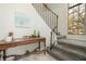Elegant entryway with a staircase, a large window, and decorative table at 307 Los Prados Dr # 307, Safety Harbor, FL 34695
