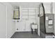 This garage features a utility sink, plenty of cabinet space, and an updated hot water heater at 3249 Parkway Pl, Palm Harbor, FL 34684