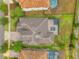 A birds eye view showing the pool and roof of this beautiful home with landscaping at 3326 Barbour Trl, Odessa, FL 33556