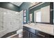Bathroom featuring a modern vanity with granite countertop and walk-in shower at 3326 Barbour Trl, Odessa, FL 33556