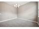 A basic bedroom with neutral-toned walls, carpeted floors, and minimalist design at 3326 Barbour Trl, Odessa, FL 33556
