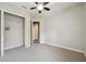 Neutral bedroom with plush carpet and closet, creating a relaxing and simple space at 3326 Barbour Trl, Odessa, FL 33556