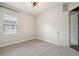Cozy bedroom filled with natural light from the window and carpeted floors at 3326 Barbour Trl, Odessa, FL 33556