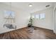 Versatile bonus room with yoga mat and decorative swing providing space for fitness or relaxation at 3326 Barbour Trl, Odessa, FL 33556