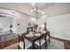 Open dining room with modern light fixture and easy access to other living areas at 3326 Barbour Trl, Odessa, FL 33556