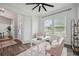 Bright home office with shiplap walls, large windows, and an elegant desk at 3326 Barbour Trl, Odessa, FL 33556