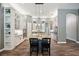 Eat-in kitchen features an island with granite countertops, breakfast bar, and pendant lighting at 3326 Barbour Trl, Odessa, FL 33556